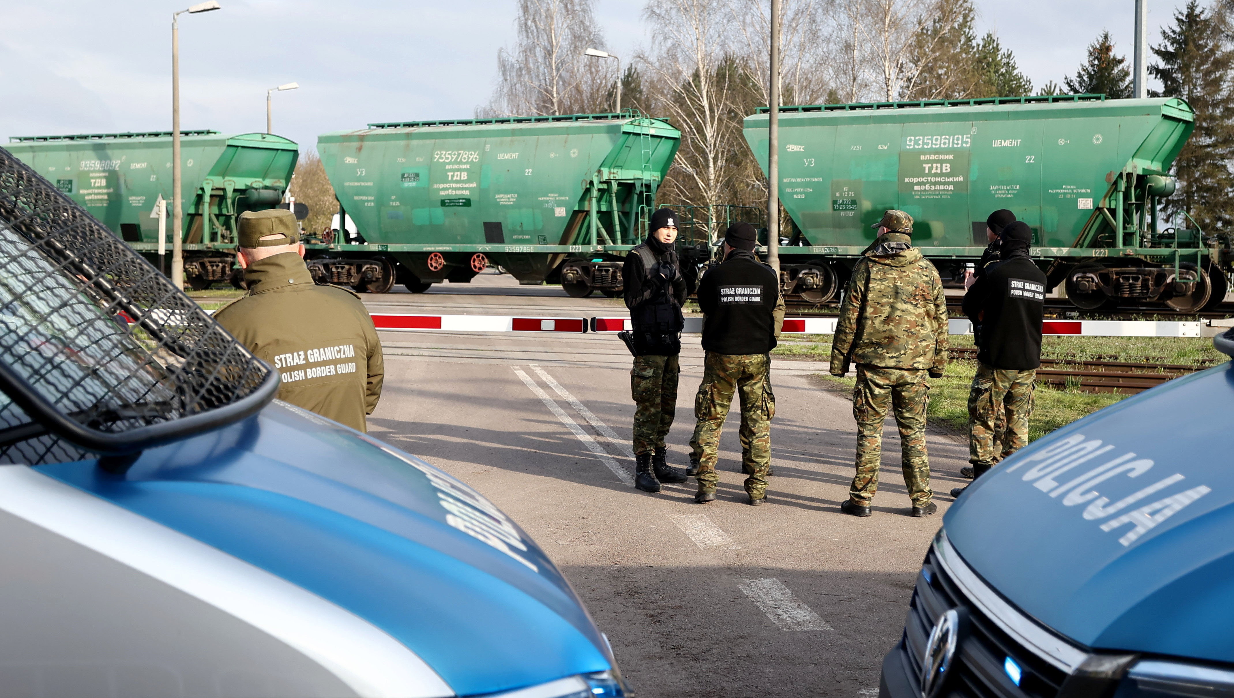 HRUBIESZOW, POLAND - APRIL 16: Train passes by place of the protest of farmers during which they tried to block railroads near the Polish-Ukrainian border in Hrubieszow, Poland on April 16, 2023. Ukrainian grain is being transported through Poland to make the export to other countries possible, but some part of it stays in the country. Polish farmers protests have begun as Ukrainian grain is cheaper than local, which has a strong impact on prices on the market. On April 15th the government of Poland announced ban of imports from Ukraine but protesters donât believe in declarations and the crisis continues. (Photo by Jakub Porzycki/Anadolu Agency via Getty Images)